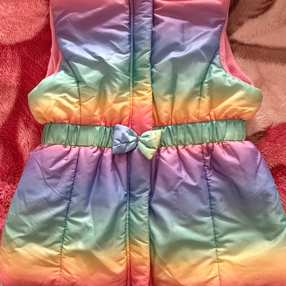 Girl’s rainbow puff vest, size7